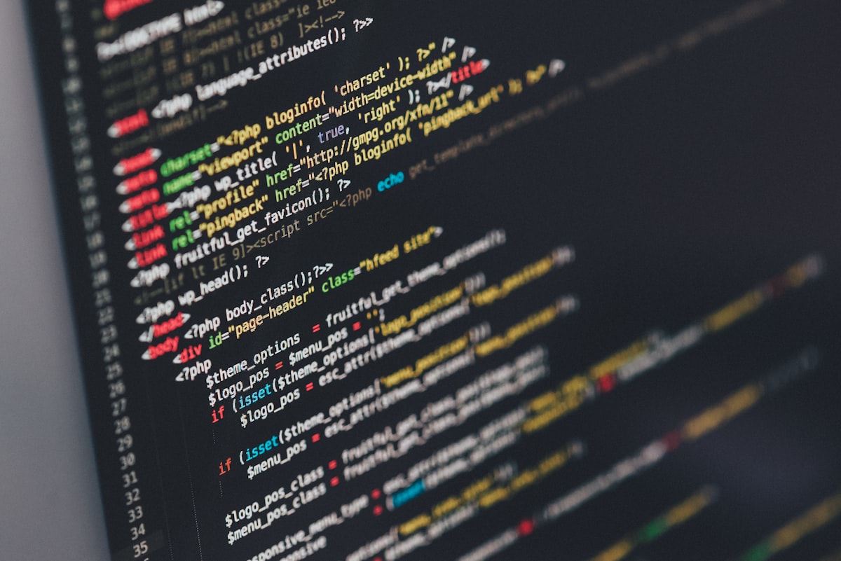 Colourful source code on a dark screen
